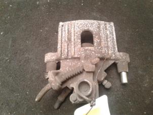Used Rear brake calliper, left BMW Mini One/Cooper (R50) 1.6 16V Cooper Price € 30,00 Margin scheme offered by Autodemontage de Zaag