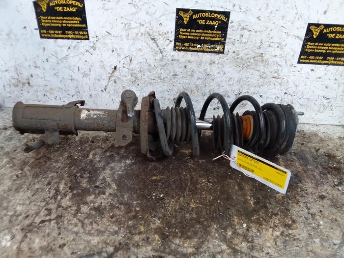 Fronts shock absorber, left from a Ford Fiesta 6 (JA8) 1.5 TDCi 2013