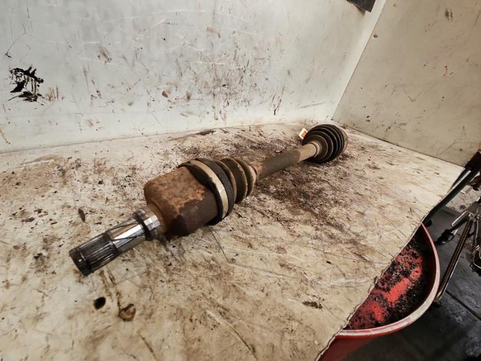 Front drive shaft, left from a MINI Mini (R56) 1.6 16V One 2010