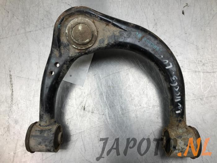 Front upper wishbone, left from a Toyota Hi-lux IV 2.5 D4-D 16V 4x4 2010