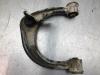 Front upper wishbone, left from a Toyota Hi-lux IV 2.5 D4-D 16V 4x4 2010