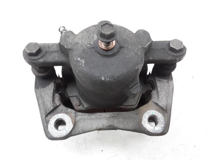 Front brake calliper, left from a Nissan Note (E12) 1.2 DIG-S 98 2016