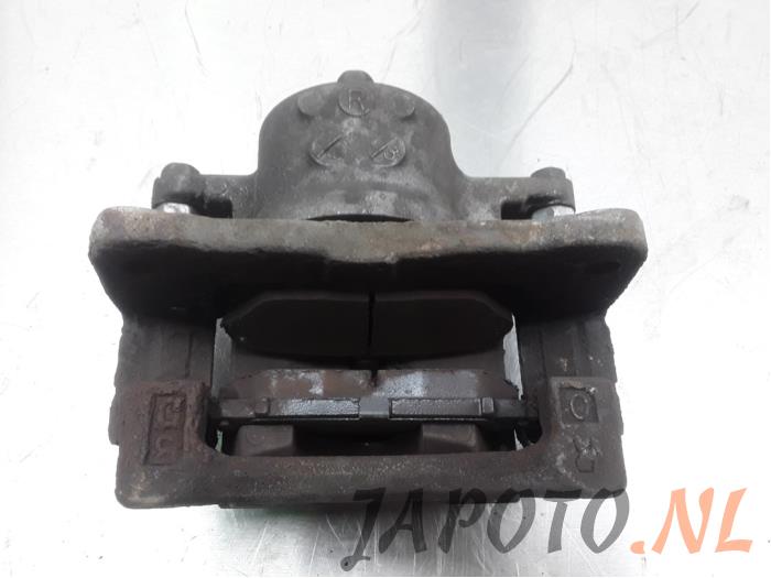 Front brake calliper, right from a Toyota Prius (ZVW3) 1.8 16V 2010