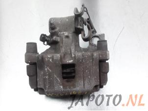 Used Rear brake calliper, left Toyota Yaris III (P13) 1.33 16V Dual VVT-I Price € 49,95 Margin scheme offered by Japoto Parts B.V.