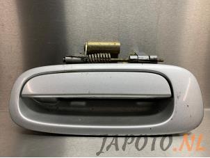 Used Rear door handle 4-door, left Toyota Corolla Wagon (E11) 1.6 16V Price € 14,95 Margin scheme offered by Japoto Parts B.V.