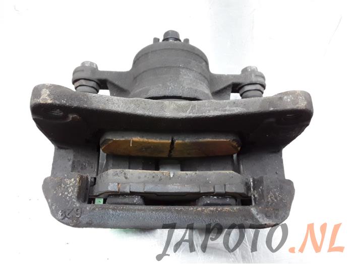 Front brake calliper, left from a Suzuki Swift (ZA/ZC/ZD) 1.2 16_ 2015