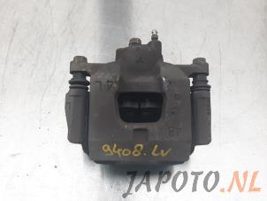 Used Front brake calliper, left Toyota iQ 1.0 12V VVT-i Price € 34,95 Margin scheme offered by Japoto Parts B.V.