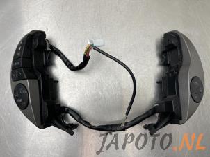 Used Steering wheel mounted radio control Toyota Prius (NHW20) 1.5 16V Price € 39,95 Margin scheme offered by Japoto Parts B.V.