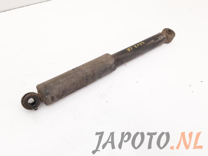 Rear shock absorber, left from a Daihatsu Terios (J1) 1.3 16V 4x4 2000
