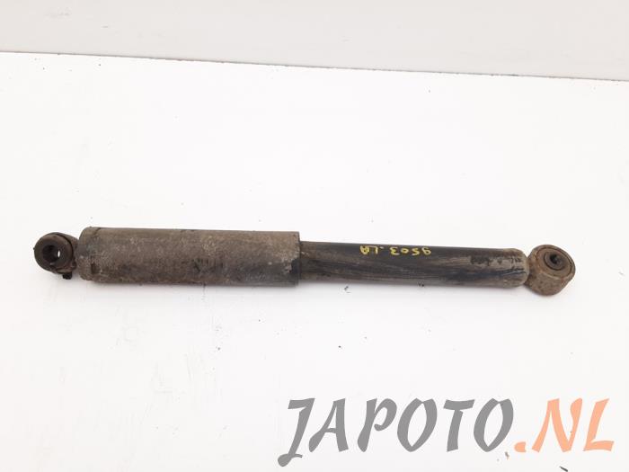 Rear shock absorber, left from a Daihatsu Terios (J1) 1.3 16V 4x4 2000