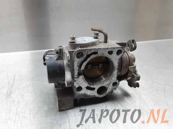 Throttle body from a Daihatsu Cuore (L251/271/276) 1.0 12V 1999