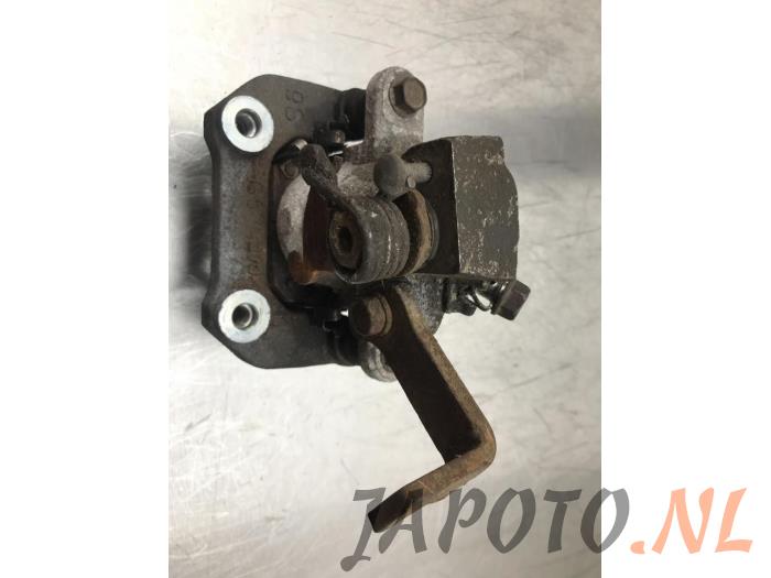 Rear brake calliper, left from a Suzuki SX4 S-Cross (JY) 1.6 16V 2014