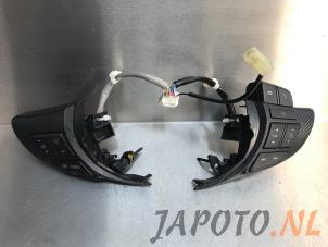 Used Steering wheel mounted radio control Mazda 3 (BM/BN) 2.0 SkyActiv-G 120 16V Price € 59,00 Margin scheme offered by Japoto Parts B.V.