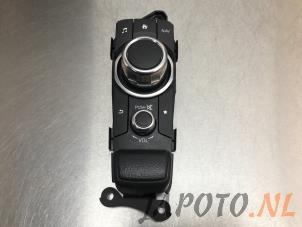 Used Navigation control panel Mazda 2 (DJ/DL) 1.5 SkyActiv-G 90 Price € 74,95 Margin scheme offered by Japoto Parts B.V.