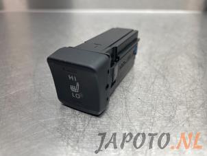 Used Seat heating switch Toyota Corolla (E21/EA1/EH1) 1.8 16V Hybrid Price € 19,95 Margin scheme offered by Japoto Parts B.V.