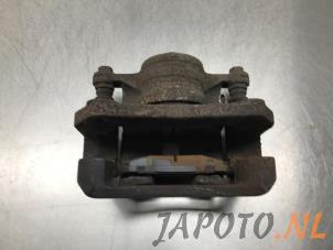 Used Front brake calliper, left Mazda 2 (DE) 1.3 16V S-VT High Power Price € 34,95 Margin scheme offered by Japoto Parts B.V.