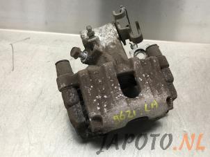 Used Rear brake calliper, left Toyota Yaris III (P13) 1.33 16V Dual VVT-I Price € 39,99 Margin scheme offered by Japoto Parts B.V.