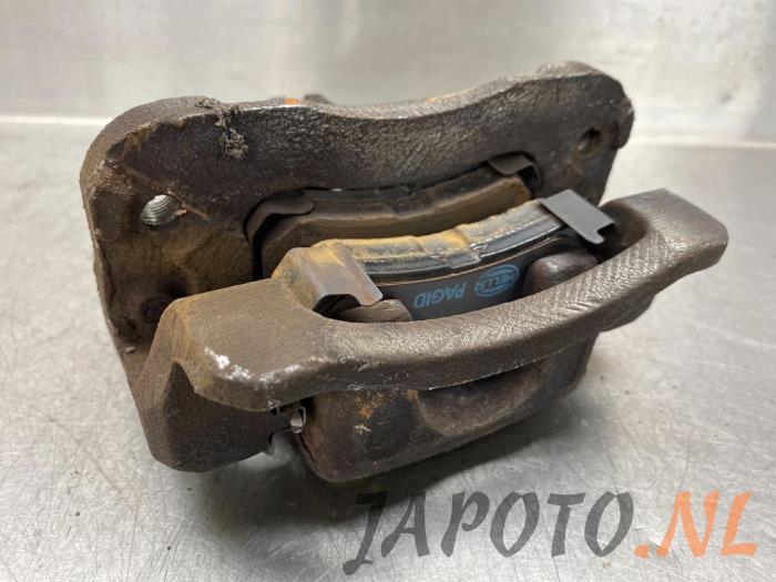 Rear brake calliper, left from a Hyundai i20 1.2i 16V 2012