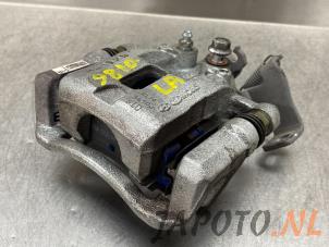 Used Rear brake calliper, left Kia Picanto (JA) 1.0 T-GDI 12V Price € 90,69 Inclusive VAT offered by Japoto Parts B.V.