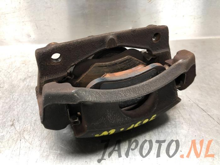 Front brake calliper, left from a Toyota Aygo (B40) 1.0 12V VVT-i 2015