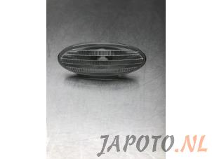 Used Indicator lens, front left Nissan Note (E11) 1.4 16V Price € 7,95 Margin scheme offered by Japoto Parts B.V.