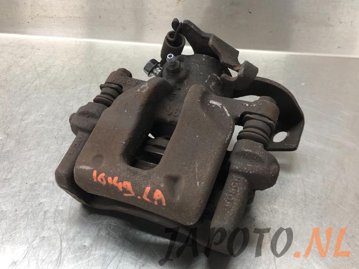 Rear brake calliper, left from a Toyota Auris (E18) 1.4 D-4D-F 16V 2013