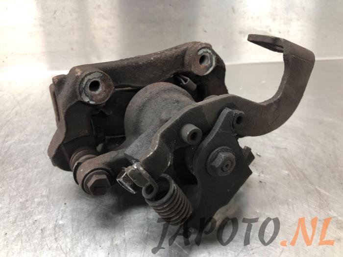 Rear brake calliper, left from a Toyota Auris (E18) 1.4 D-4D-F 16V 2013