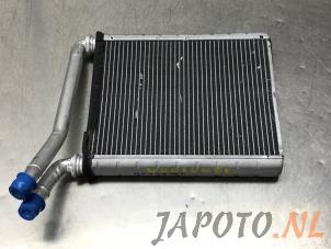 Usados Radiador de calefactor Toyota Auris Touring Sports (E18) 1.2 T 16V Precio € 59,00 Norma de margen ofrecido por Japoto Parts B.V.