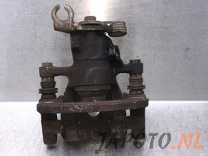 Used Rear brake calliper, left Mitsubishi Colt (Z2/Z3) 1.5 16V CZT Turbo Price € 39,95 Margin scheme offered by Japoto Parts B.V.
