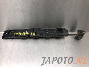 Używane Wspornik zderzaka lewy tyl Nissan NV 200 (M20M) E-NV200 Cena € 24,95 Procedura marży oferowane przez Japoto Parts B.V.
