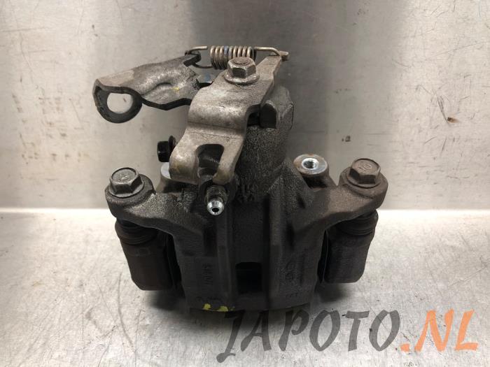Rear brake calliper, left from a Hyundai iX20 (JC) 1.6i 16V 2019