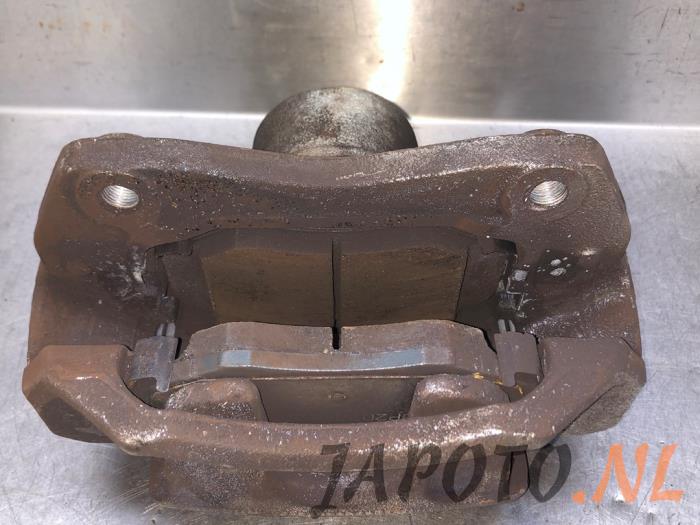 Front brake calliper, right from a Hyundai iX20 (JC) 1.6i 16V 2019