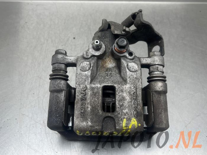 Rear brake calliper, left from a Kia Picanto (JA) 1.0 T-GDI 12V 2018