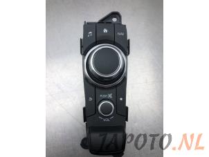 Used Navigation control panel Mazda 2 (DJ/DL) 1.5 SkyActiv-G 90 Price € 74,95 Margin scheme offered by Japoto Parts B.V.