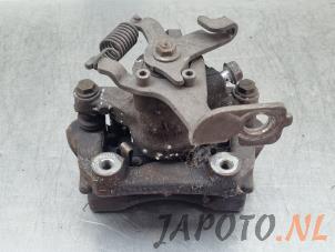 Used Rear brake calliper, left Toyota Auris Touring Sports (E18) 1.2 T 16V Price € 59,95 Margin scheme offered by Japoto Parts B.V.