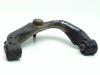 Front upper wishbone, left from a Nissan Navara (D40) 2.5 dCi 16V 4x4 2007