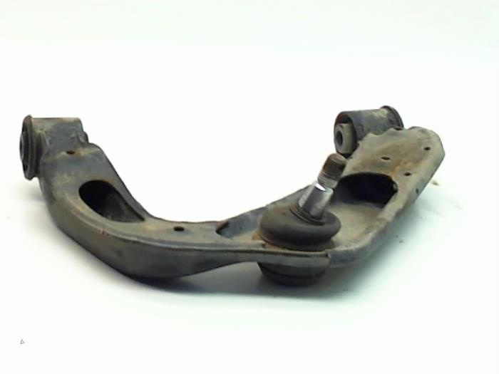 Front upper wishbone, right from a Nissan Navara (D40) 2.5 dCi 16V 4x4 2007