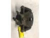 Front brake calliper, left from a Renault Modus/Grand Modus (JP) 1.2 16V TCE 100 2008