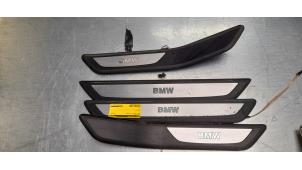 Usagé Bande décorative BMW 7 serie (F01/02/03/04) 750i,Li,LiS V8 32V Prix € 50,00 Règlement à la marge proposé par Poolman autodemontage