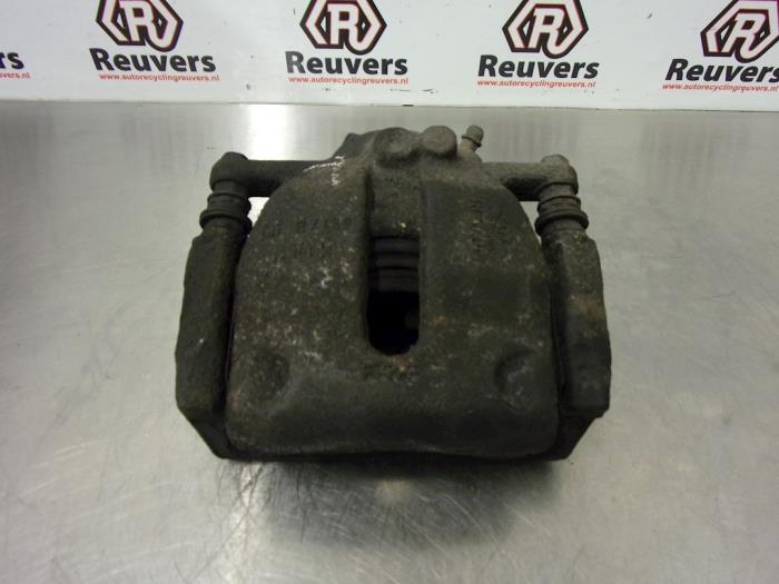 Front brake calliper, left from a Renault Kangoo Express (FW) 1.5 dCi 105 FAP 2009