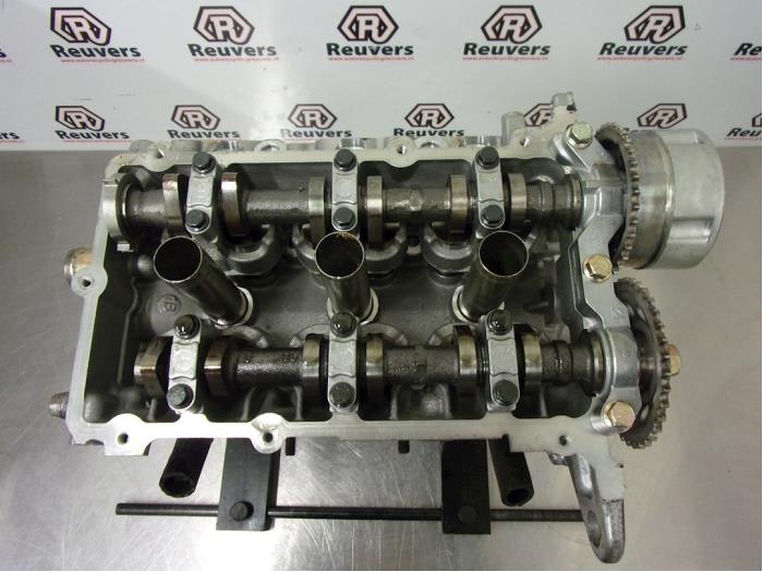 Cylinder head from a Smart Forfour (454) 1.1 12V 2005
