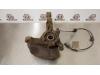 Knuckle, front left from a Opel Astra H SW (L35) 1.7 CDTi 16V 2010