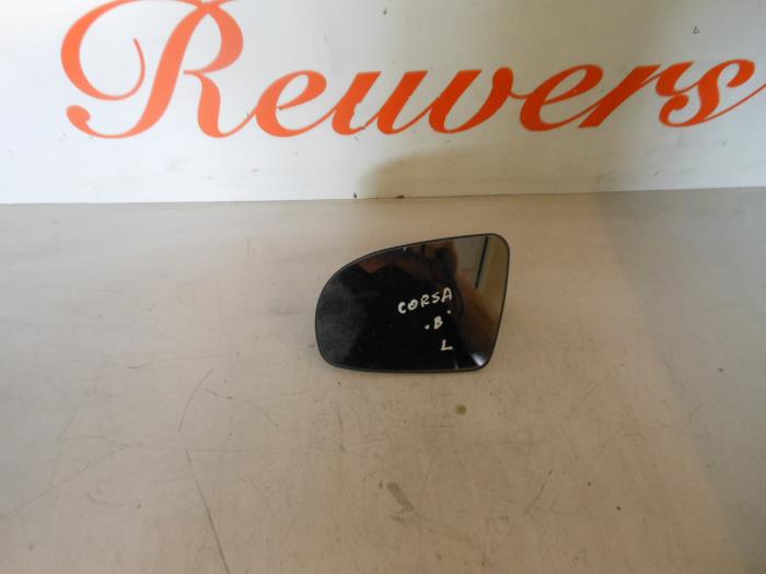 Mirror glass, left from a Opel Corsa B (73/78/79) 1.0i 12V 2000