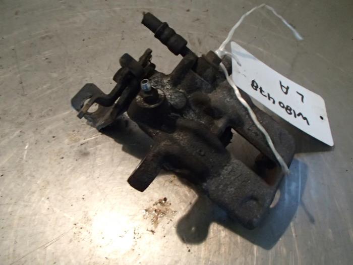 Rear brake calliper, left from a Nissan Primera Estate (WP11) 2.0 16V 2001
