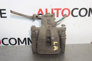 Used Rear brake calliper, left Renault Clio III (BR/CR) 1.6 16V Price on request offered by Autocommerce