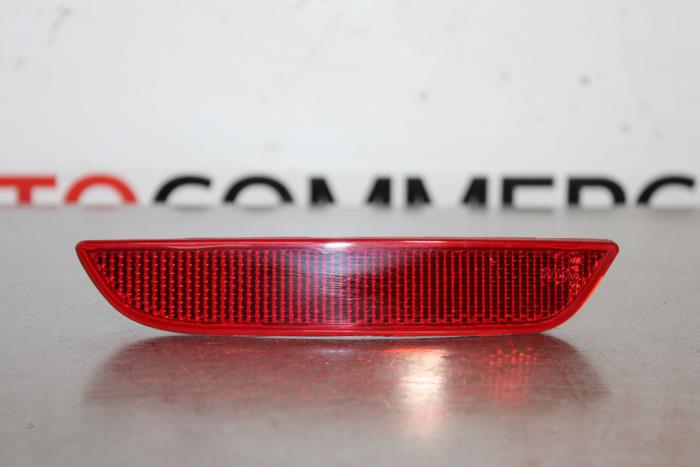Rear bumper reflector, left from a Renault Clio IV (5R) 0.9 Energy TCE 90 12V 2012