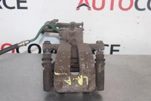 Używane Zacisk hamulcowy lewy tyl Renault Megane II (LM) 1.4 16V 98 Cena na żądanie oferowane przez Autocommerce