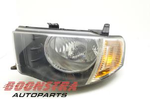 Used Headlight, left Mitsubishi L-200 2.5 DI-D 4x4 Price € 74,25 Margin scheme offered by Boonstra Autoparts