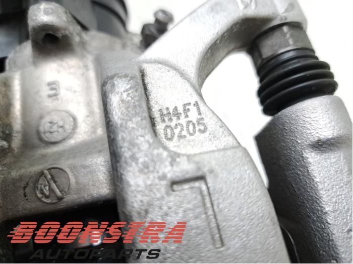 Rear brake calliper, left from a BMW 3 serie (G20) 318i 2.0 TwinPower Turbo 16V 2022