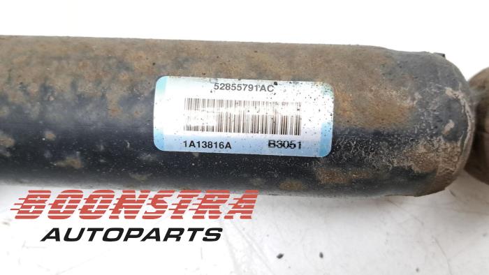 Rear shock absorber rod, left from a Dodge Ram 1500 Crew Cab (DS/DJ/D2) 5.7 V8 Hemi 2500 4x4 2013